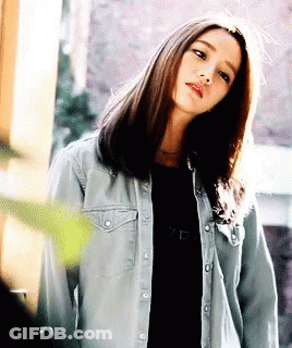 Woman In Denim Jacket And Black Shirt GIF