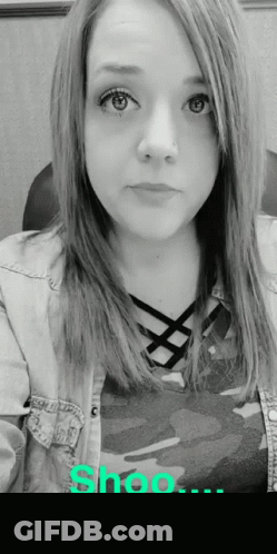Woman In Denim Jacket And Camo Shirt GIF