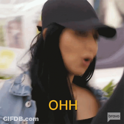 Woman In Denim Jacket And Hat Saying Ohh In Yellow GIF
