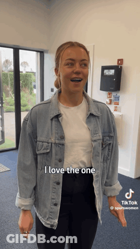 Woman In Denim Jacket And White Shirt Says I Love The One GIF