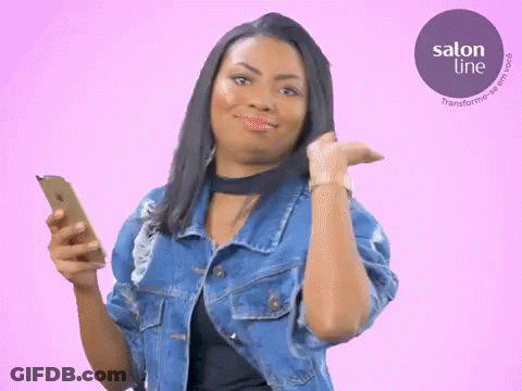 Woman In Denim Jacket Holding Cell Phone And Watch GIF