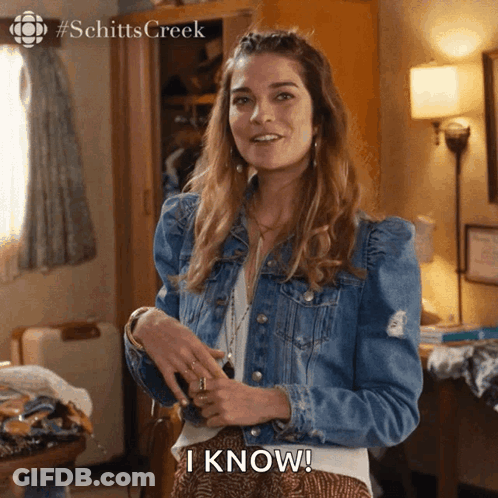 Woman In Denim Jacket Saying I Know GIF
