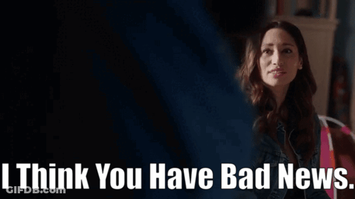 Woman In Denim Jacket Sitting In Living Room GIF