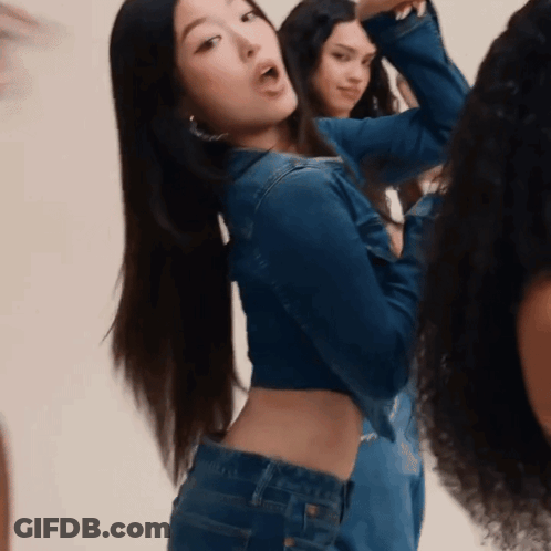 Woman In Denim Jacket With Group Of Women GIF