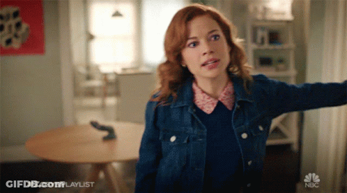 Woman In Denim Jacket With NBC Logo GIF