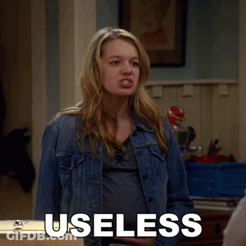 Woman In Denim Jacket With Useless On Chest GIF