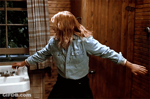 Woman In Denim Shirt At Bathroom Sink GIF