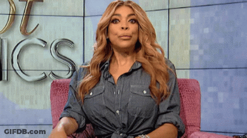 Woman In Denim Shirt In Pink Chair With Word Ics GIF