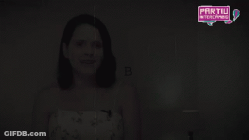Woman In Detective Hat Holding Magnifying Glass GIF