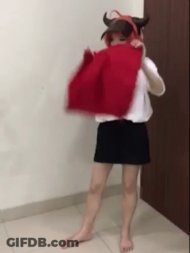 Woman In Devil Costume With Red Cloth Over Head GIF