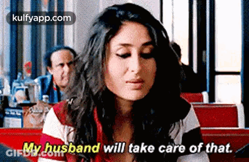 Woman In Diner Talking To Husband Behind Her GIF