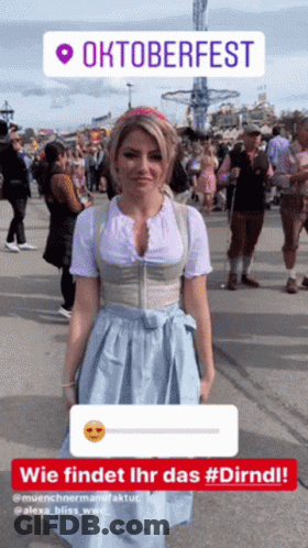 Woman In Dirndl In Front Of Oktoberfest Sign GIF
