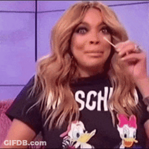 Woman In Donald Duck T-Shirt Holding Lollipop GIF