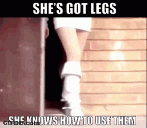 Woman In Doorway Wearing White Boots And Skirt GIF