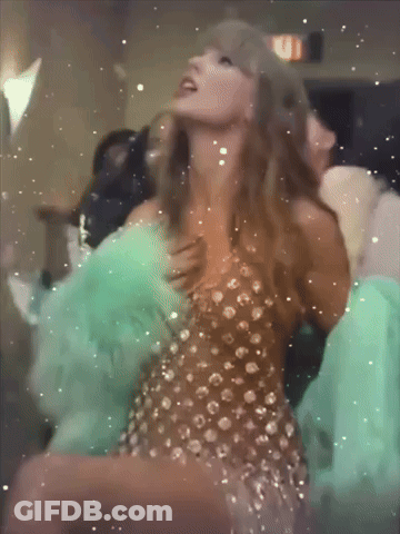 Woman In Dress Dancing With Fire Exit Sign GIF