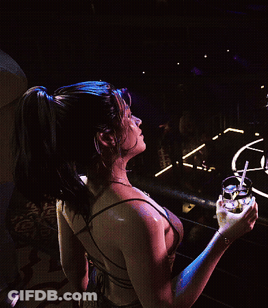 Woman In Dress Holding Drink With Straw GIF