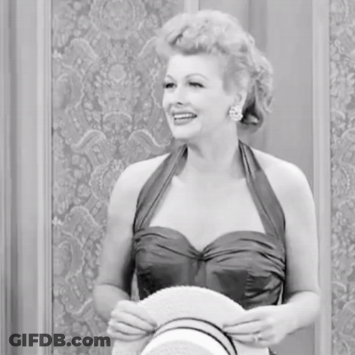 Woman In Dress Holding Hat Smiling GIF