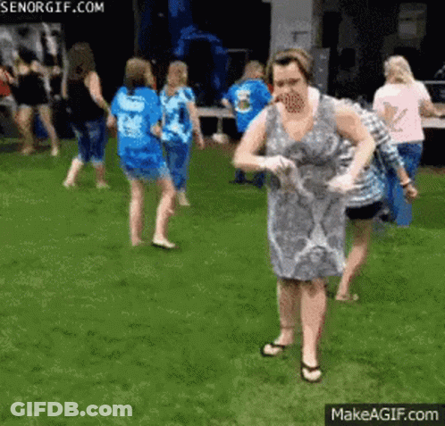 Woman In Dress In Front Of Group GIF