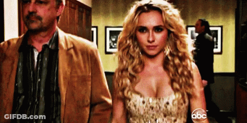 Woman In Dress Next To Man In Jacket GIF