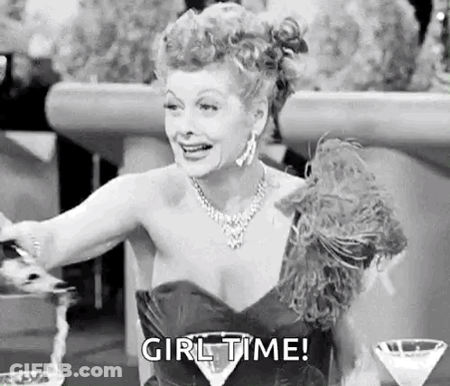Woman In Dress Sitting At Table With Martini GIF