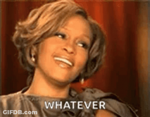 Woman In Dress Smiling Saying Whatever GIF