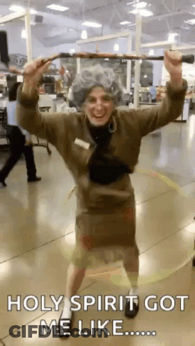 Woman In Elderly Costume Holding Cane GIF