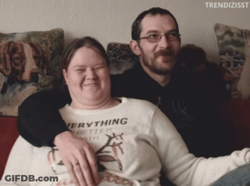 Woman In Everything Better With Sweater Next To Man GIF