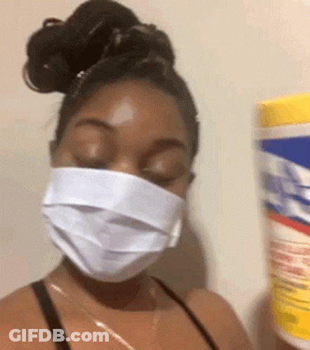 Woman In Face Mask Holding Bucket Of Tissues GIF