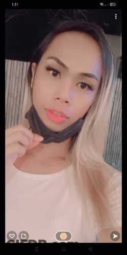 Woman In Face Mask Taking Selfie GIF