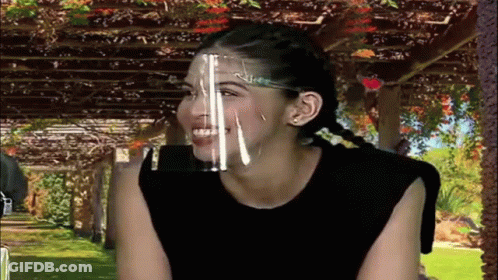 Woman In Face Shield Smiling GIF