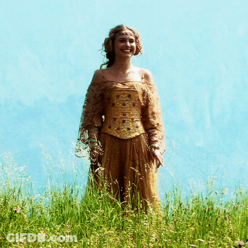 Woman In Fancy Dress In Tall Grass GIF