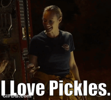 Woman In Fireman Uniform Smiling Says I Love Pickles GIF