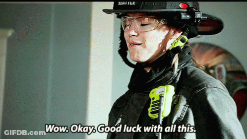 Woman In Fireman Uniform Wow Okay Good Luck GIF