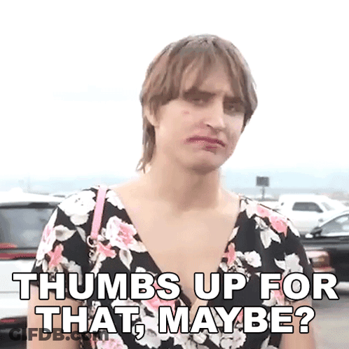 Woman In Floral Dress Giving Thumbs Up GIF