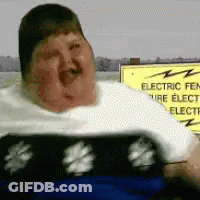 Woman In Floral Dress Holding Chest GIF