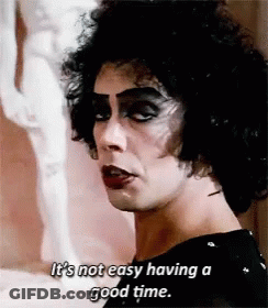 Woman In Floral Dress Holding Water Saying Get A Clue Man GIF