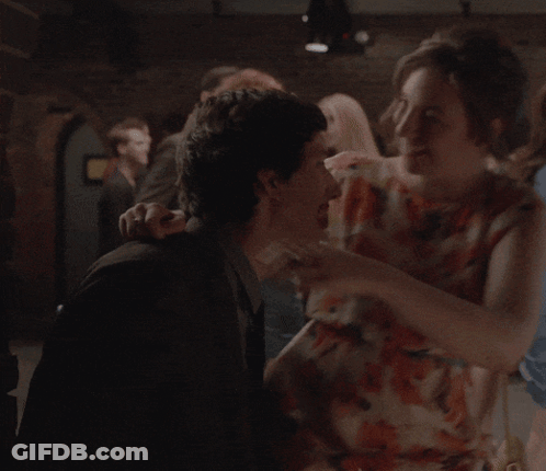 Woman In Floral Dress Hugging Man GIF