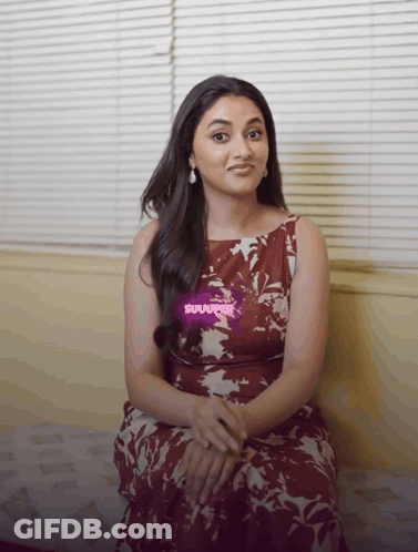 Woman In Floral Dress On Couch With Suuuper Sticker GIF