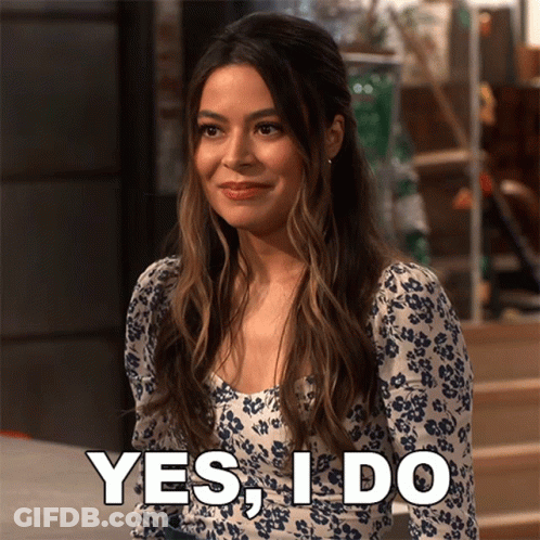 Woman In Floral Dress Saying Yes GIF