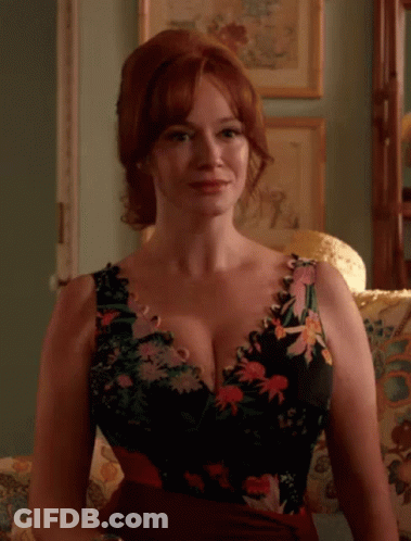 Woman In Floral Dress Sitting GIF