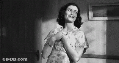 Woman In Floral Dress Standing GIF