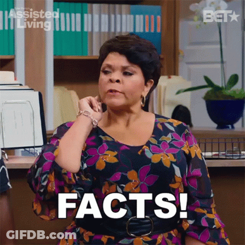 Woman In Floral Dress Talking On Phone GIF