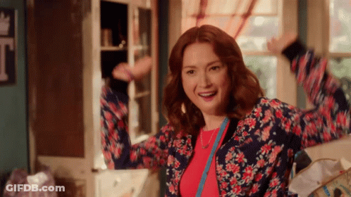 Woman In Floral Jacket Dancing GIF