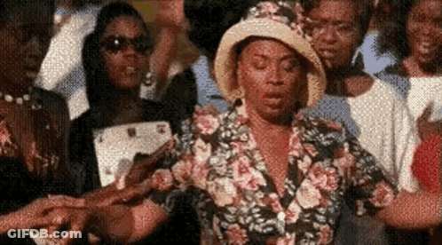 Woman In Floral Shirt Holding Hands GIF