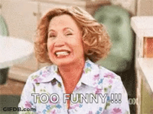 Woman In Floral Shirt Laughing Saying Too Funny GIF