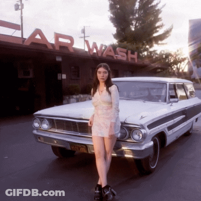 Woman In Floral Shirt Sitting In Car Saying Eww GIF