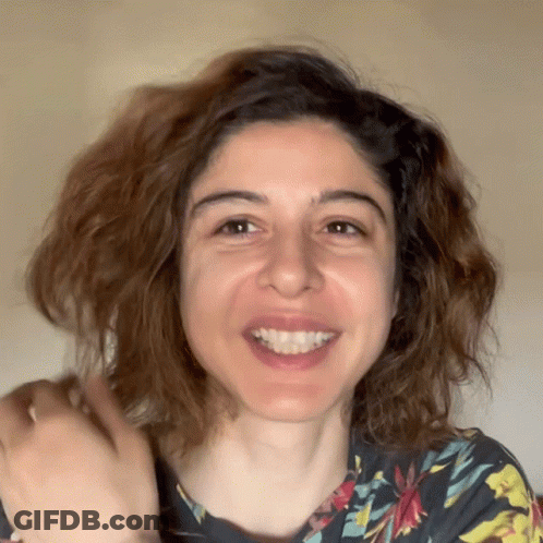 Woman In Floral Shirt Smiling GIF