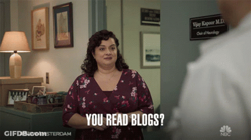Woman In Floral Shirt You Read Blogs GIF
