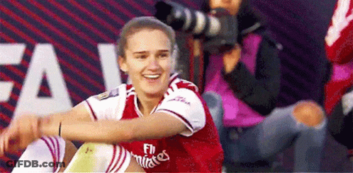 Woman In Fly Emirates Jersey Smiling GIF