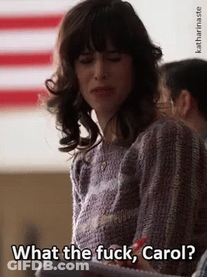 Woman In Front Of American Flag Saying What The Fuck Carol GIF